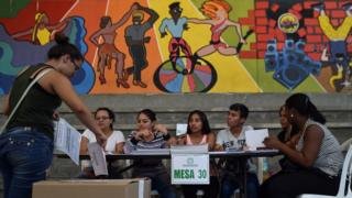 A woman casts her vote at a polling station in Cali, Valle del Cauca Department, during parliamentary elections in Colombia on March 11, 2018.