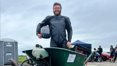 Dylan Phillips Dylan Phillips with his record-breaking wheelbarrow