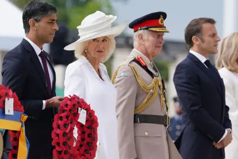 Reuters Rishi Sunak stands along side the King and Queen at D-Day event in Normandy