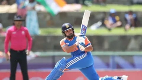 Getty Images Rohit Sharma of India hits a four as he bats during the ICC Men's T20 Cricket World Cup West Indies & USA 2024 Super Eight match between India and Bangladesh at Sir Vivian Richards Stadium on June 22, 2024 in Antigua, Antigua and Barbuda. (