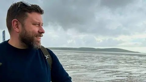 Matt Knibb Matt Knibb looking out over water