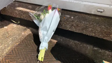 Floral tribute to woman who died in house fire, Bakersfield