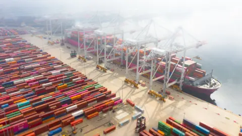 Getty Images Container ship being loaded in port, UK