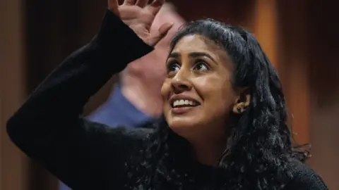 Patch Dolan Purvi Parmar with one arm in the air in rehearsals as Olivia in Twelfth Night