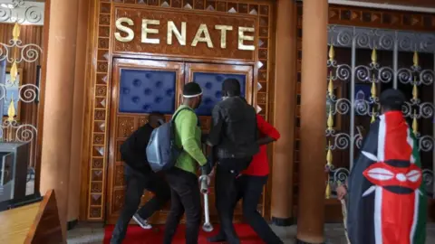 EPA Demonstrators breach into Parliament during a protest against tax hikes in Nairobi, Kenya, 25 June 2024.