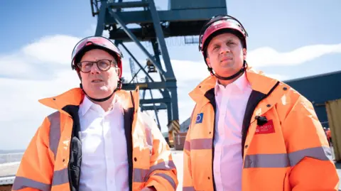 PA Media Sir Keir Starmer and Anas Sarwar of Labour promoting the party's green energy plans in Scotland