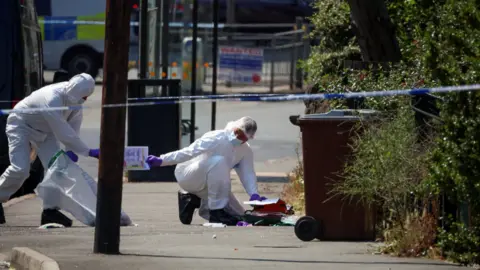 Reuters Forensic officers