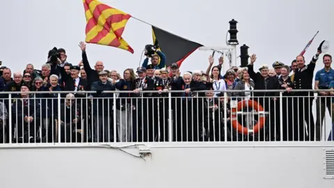  Reuters Veterans on Brittany Ferries ship Mont St Michel smiling and waving