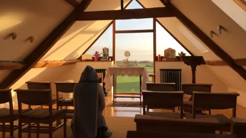 The Community of Our Lady of Walsingham A sister praying in the convent chapel