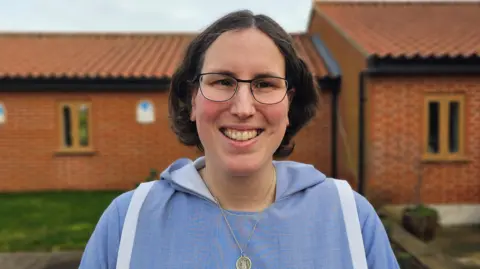 Paul Moseley/BBC  Sister Theresa, smiling in the grounds of the convent