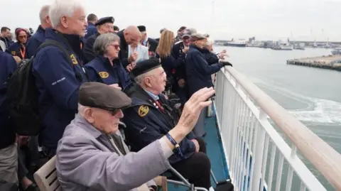 PA Media D-Day veterans gather on the deck of the Mont St Michel