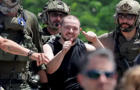 Reuters Almog Meir Jan, a released hostage reacts, after the military said that Israeli forces have rescued four hostages alive from the central Gaza Strip