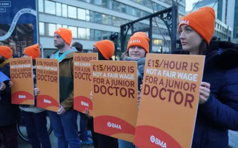 PA Media Junior doctors and members of the British Medical Association (BMA) outside St Thomas' Hospital, London, as they took to picket lines for six days during their continuing dispute over pay