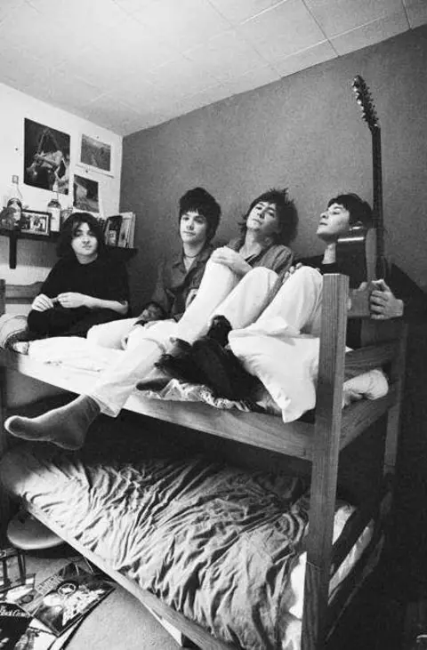 Valerie Phillips The Manic Street Preachers huddled together on a bunk bed