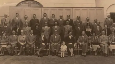 Susannah Herbert Black-and-white photo of colonial officials, with little boy at the front dressed in white, who is Susannah's father