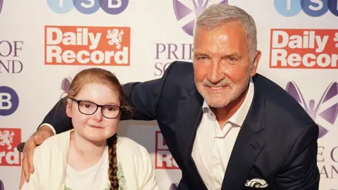 PA Media Isla Grist and footballer Graeme Souness at the Pride of Scotland Awards