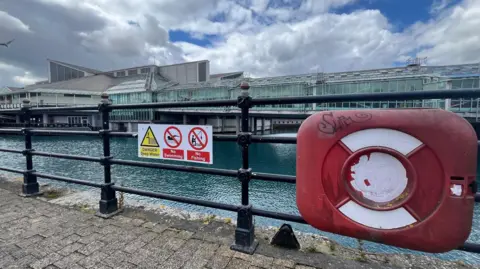 Kevin Shoesmith/BBC A 'no fishing' sign at Princes Dock, Hull