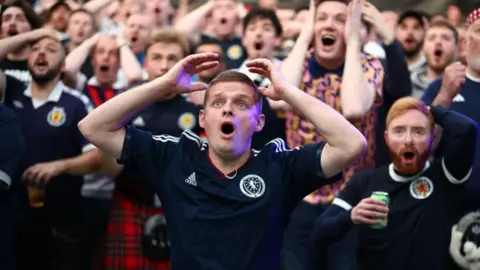 Getty Images A fan holds his head in disbelief