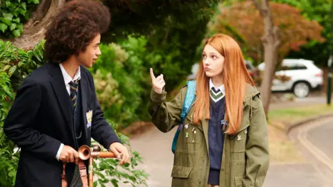 Rich Cain/Netflix Zac Looker (l), who plays Toby Pilgrim, with Emily Carey