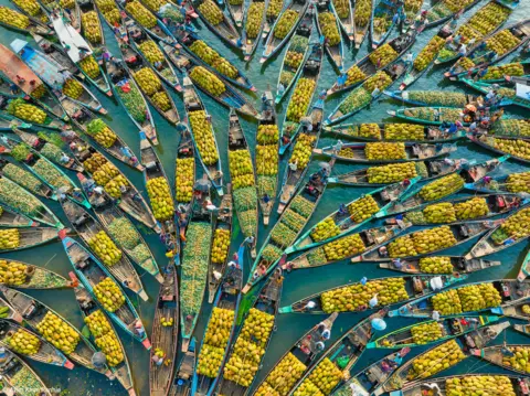 Azim Khan Ronnie Early every morning in Rangamati, Bangladesh, boats selling fresh fruit create a floating market