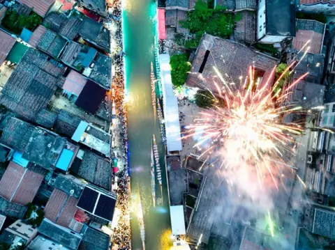 Xinhua/REX/Shutterstock An aerial view shows a dragon boat race in China's Fujian Province