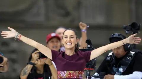 Reuters Presidential candidate of the ruling MORENA party Claudia Sheinbaum gestures during her closing campaign rally at Zocalo Square, in Mexico City, Mexico May 29, 2024.