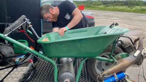 Dylan Phillips Dylan building the motorised wheelbarrow