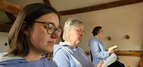 Paul Moseley/ BBC Three sisters praying