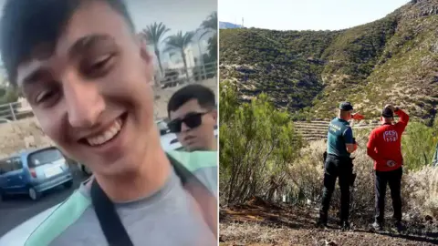 Handout/PA Media Jay Slater, wearing a grey t-shirt with a green stripe, and two members of a search team looking into a ravine in Tenerife