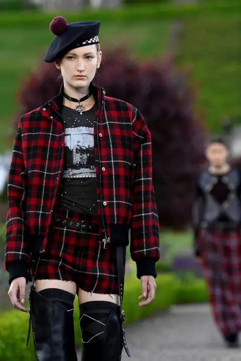 PA Model in tartan at Christian Dior cruise show