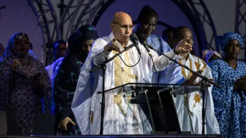 AFP President of Mauritania looks over a crowd at a final rally