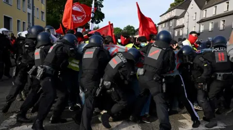 Reuters Police and protesters in Essen