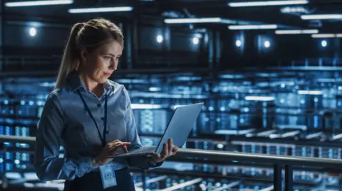 Getty Images Stock shot of worker in a data centre