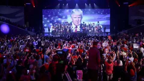 Reuters Republican presidential candidate and former President Donald Trump arrives to deliver a campaign speech during a Turning Point USA event at the Dream City Church in Phoenix