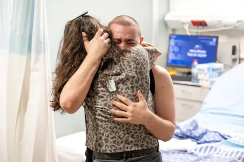 Reuters Almog Meir Jan embraces a family member