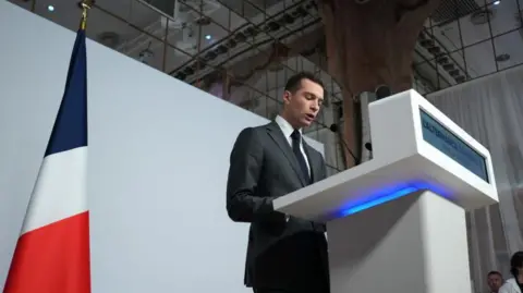  Nathan Laine/Bloomberg Jordan Bardella, president of National Rally, speaks at a news conference in Paris, France, on Monday, June 24, 2024