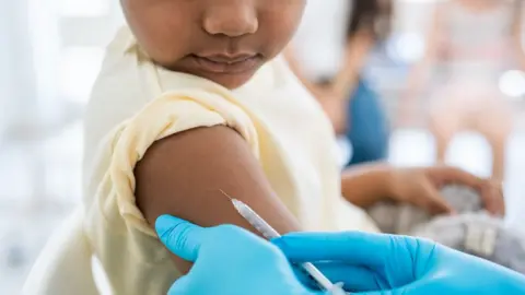 Getty Images Picture of a child receiving a vaccination