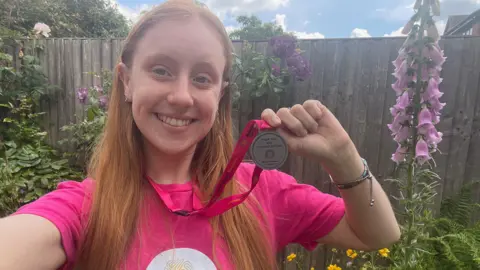 Charlotte Greatorex Charlotte Greatorex holding a medal