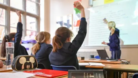 PA Media Secondary school pupils in a classroom