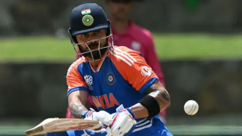 AFP India's Virat Kohli hits a shot during the ICC men's Twenty20 World Cup 2024 Super Eight cricket match between India and Bangladesh at Sir Vivian Richards Stadium in North Sound, Antigua and Barbuda, on June 22, 2024. (