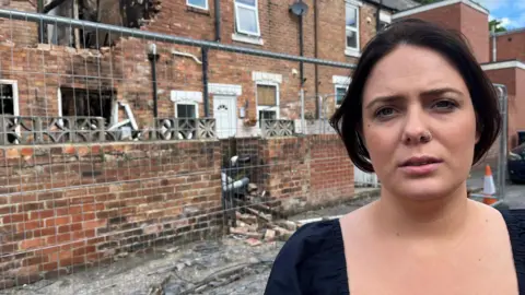 BBC Grace outside her neighbour's house on Coronation Terrace in Willington