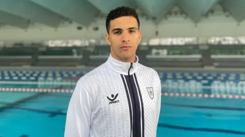 Yazan in his Palestinian Olympic Committee uniform