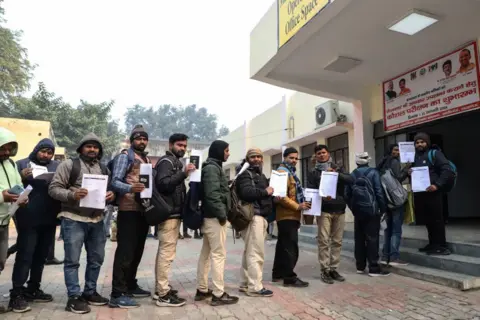 Getty Images Indian workers align to submit registration forms as they seek employment in Israel during a recruitment drive at the Industrial Training Institute (ITI) in Lucknow, capital of India's Uttar Pradesh state on January 25, 2024.