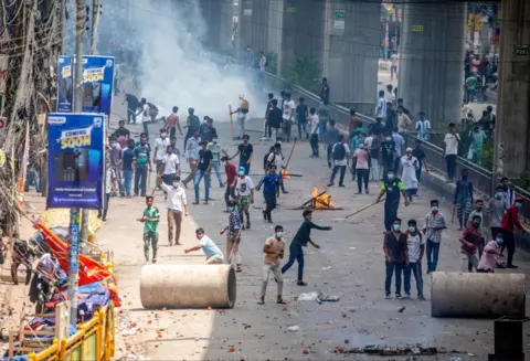 EPA Demonstrators clash with police, Bangladesh Chhatra League (BCL) and Jubo League members, during ongoing quota students protests under the slogan 'Anti-Discrimination Student Movement' at Mirpur area in Dhaka, Bangladesh, 18 July 2024