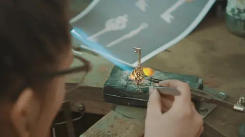 Close-up of a designer making a decorative key