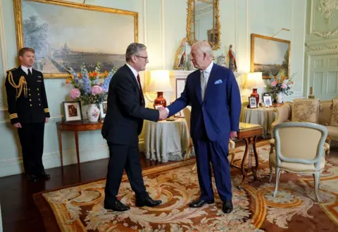 Yui Mok/PA Media King Charles III welcomes Sir Keir Starmer during an audience at Buckingham Palace, London, where he invited the leader of the Labour Party to become Prime Minister and form a new government following the landslide General Election victory for the Labour Party, 5 July 2024.