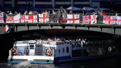  Ben Birchall/PA Media England fans at Weidendammer Brucke in Berlin