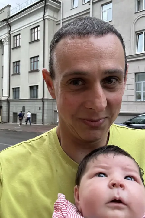 Family handout / PA Real Life Graeme and Bella outside the British Embassy in Minsk