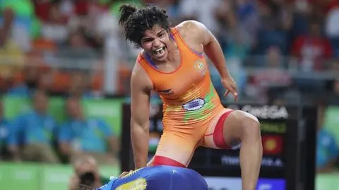 Getty Images Sakshi Malik of India celebrates victory against Aisuluu Tynybekova of Kyrgyzstan during their Women's Freestyle 58 kg Bronze Medal Final at the Carioca Arena 2 on August 17, 2016 