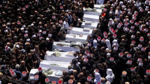 Getty Images Funeral held for those killed in strike